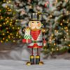 "Nikolai" the Metal Nutcracker Holding Gifts