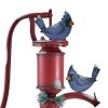 Old Style Iron Water Pump with "Merry Christmas" Sign and Birds